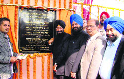 PWD Minister Sharanjit Singh Dhillon inaugurates a power grid at Ghulal village on Saturday. A tribune photograph