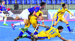 A Punjab Warriors player takes a tumble during the HIL league match in Mohali on Saturday. Tribune photo 