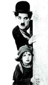 Jackie Coogan with Charlie Chaplin in The Kid