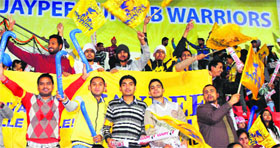 Spectators cheer for Punjab Warriors during a match of the ongoing Hockey India League at Mohali on Sunday.