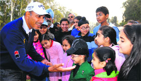 Jeev Milka Singh interacts with budding players at the Chandigarh Golf Club on Sunday.