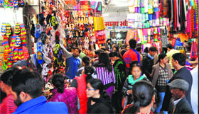 Shopkeepers selling goods outside shops in the Shastri Market, Sector 22.