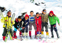 Children get ready for skiing in Manali on Sunday