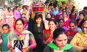 Members of the BJP Mahila Morcha take out a jago as part of campaign for the forthcoming Lok Sabha elections, in Jalandhar on Sunday