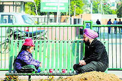 A father and his daughter enjoy coffee on a sunny day at Punjab Agricultural University in Ludhiana on Sunday morning