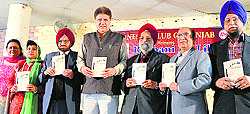 Delegates release a book by Dr Rajinder Toki at the Punjab Bhawan in Ludhiana on Sunday