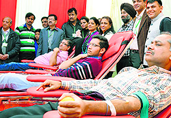 Volunteers donate blood during a camp organised by the Zindagi Live Foundation in collaboration with the Sutlej Club in Ludhiana on Sunday