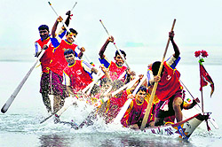 Participants during a boat race in the Brahmaputra on the closing day of the 'Carnival of Traditional Sports in Guwahati on Sunday