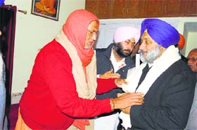 Deputy CM Sukhbir Badal interacts with Chetna Nand, the head of the Bhuriwale sect, in Nawanshahr on Saturday