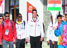 Indian athletes walk proudly during a special ceremony held at Sochi for hoisting the Indian flag