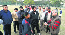 Dr Mandeep S Dhillon, professor, Department of Orthopaedics, PGIMER, interacts with coaches during a session at the Sports Complex in Sector 42 on Monday. Tribune photo: Pradeep Tewari