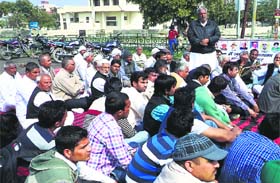 Representatives of the Sarv Jat Khap Panchayat discuss the issue of reservation in Kaithal on Monday