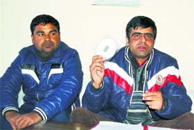 Puneet Malli (L) former general secretary of the Youth Congress, addresses a press conference in Dharamsala on Monday