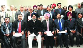 Deputy CM Sukhbir Badal with officials of IT companies in Mohali on Monday.