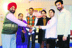 Officials honour students at Malwa College in Bathinda on Tuesday