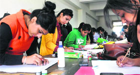 Students take part in a poster-making competition at the Northern India Institute of Fashion Technology in Mohali on Tuesday.