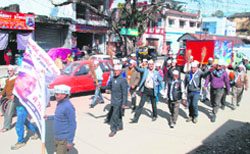Aam Aadmi Party workers hold a march in Dehradun on Tuesday. A tribune photograph 
