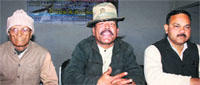 Ram Babu Junglee, a wildlife enthusiast (centre), talking to mediapersons in Dehradun on Tuesday. A tribune photograph 