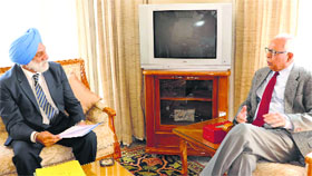 Vice Chancellor of Jammu University Prof Mohan Pal Singh Ishar briefs Governor NN Vohra on important matters relating to the functioning of the varsity at Raj Bhawan in Jammu on Tuesday.
