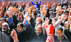 Activists of the Jammu and Kashmir Kisan Tahreek hold a protest in support of their demands in Srinagar on Tuesday.
