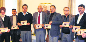Governor NN Vohra releases the Amarnath yatra guide book at Raj Bhawan.