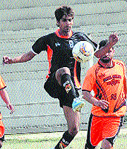 Players of Shaheed Bhagat Singh Nagar and Hoshiarpur teams during a football match in Jalandhar on Tuesday