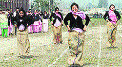 Students participate in a sack race in Jalandhar on Tuesday