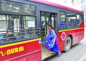 A woman boards the special bus in Ludhiana