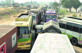 A traffic jam caused by the protest on the national highway in Ludhiana on Tuesday