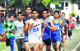 Students compete in a race during the athletics meet at Arya College
