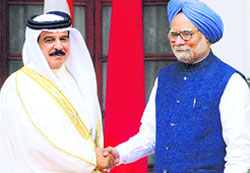 King of Bahrain Hamad bin Isa Al Khalifa shakes hands with Prime Minister Manmohan Singh in New Delhi on Wednesday. He is in India on a three-day state visit. Tribune photo: Mukesh Aggarwal