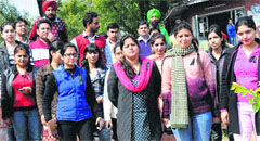 Employees of the Chandigarh College of Engineering and Technology hold a silent protest by wearing black badges in Chandigarh on Wednesday. Tribune photo