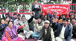 Employees of the Postal Department in Dehradun on Wednesday
