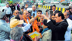 Members of the Toll Hatao Sangharsh Samiti celebrate after the decision of the Delhi High Court regarding the removal of the Sirhaul and Kherki Dhaula toll plazas in Gurgaon on Wednesday