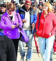 Foreigners enjoy a sunny day in Shimla on Wednesday. 