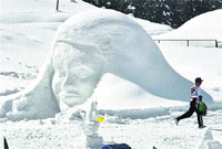 A man walks past a snow sculpture in Gulmarg. Photo: Yawar Kabli