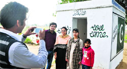 Zeba Rashid of Karachi along with her children at the Zero Line on the Pakistani side along the international border.
