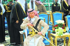 Britains Prince Charles wears traditional Saudi uniform as he attends the traditional form of Saudi dancing performed during the Janadriya culture festival in Riyadh