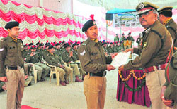 Arvind Kumar, IG, North-West Frontier, honours an officer of the ITBP during the Raising Day celebrations in Chandigarh on Thursday. Tribune photo: Parvesh Chauhan