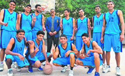 Cagers of the Air Force Club in a jubilant mood after clinching the trophy of the Senior State Basketball Championship in Chandigarh on Thursday. tribune photo: parvesh chauhan