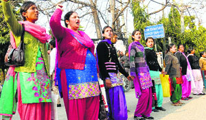 AIE/STR teachers block traffic in Jalandhar on Thursday.
