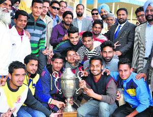 Players of the Hoshiarpur football team in a jubilant mood after winning the 66th Punjab State Senior Football Championship in Jalandhar on Thursday.