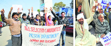 Selected candidates for the posts of jail warden and members of the All J&K Gaddi Sippi Tribes Welfare Association protest in Jammu on Thursday. Tribune photos: Inderjeet Singh