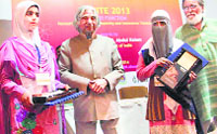 Mahirah Akhter and Morifat Wani after receiving award from former President of India Dr APJ Abdul Kalam at the Indian Institute of Management, Ahmedabad, on Wednesday. A Tribune photograph