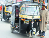 Locals rue that the autorickshaw drivers fluctuate the rates and there is no one to keep a check on it. Tribune photo: Amin War