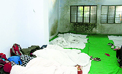 The women judokas wrap up themselves in a few quilts made available to escape the bone-chilling cold in a damp and cramped room