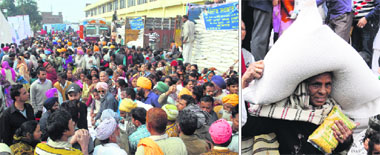 The BPL beneficiaries at Industrial office in the Maqboolpura area get ration under the revised Atta-Dal Scheme in Amritsar on Friday.