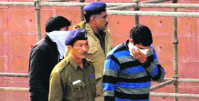 A file photo of two of the accused in police custody.