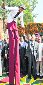 Governor Shivraj Patil shakes hands with a performer.
