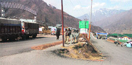 Trucks wait outside the trade facilitation centre at Salamabad in Uri on Friday.